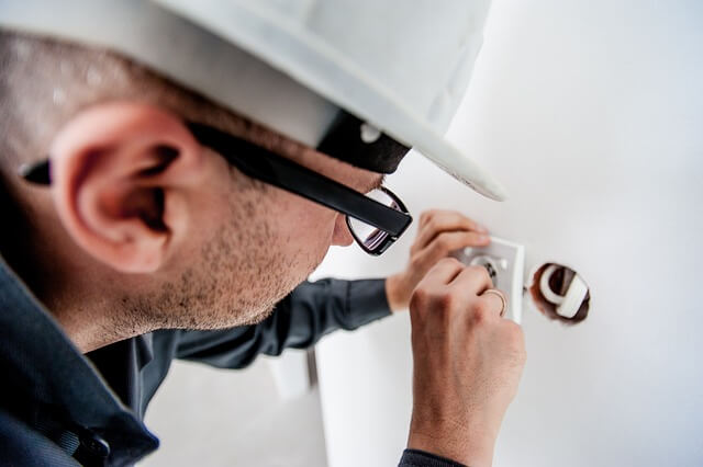 electrician installing socket